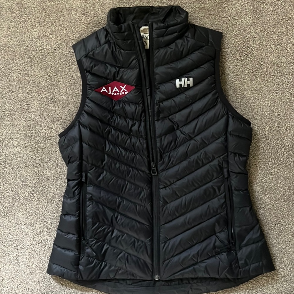 Helly Hansen puffer vest with ajax tavern logo